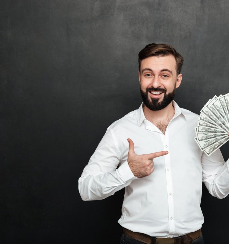 portrait-adult-man-white-shirt-posing-camera-with-fan-100-dollar-bills-hand-being-rich-happy-dark-gray_171337-588